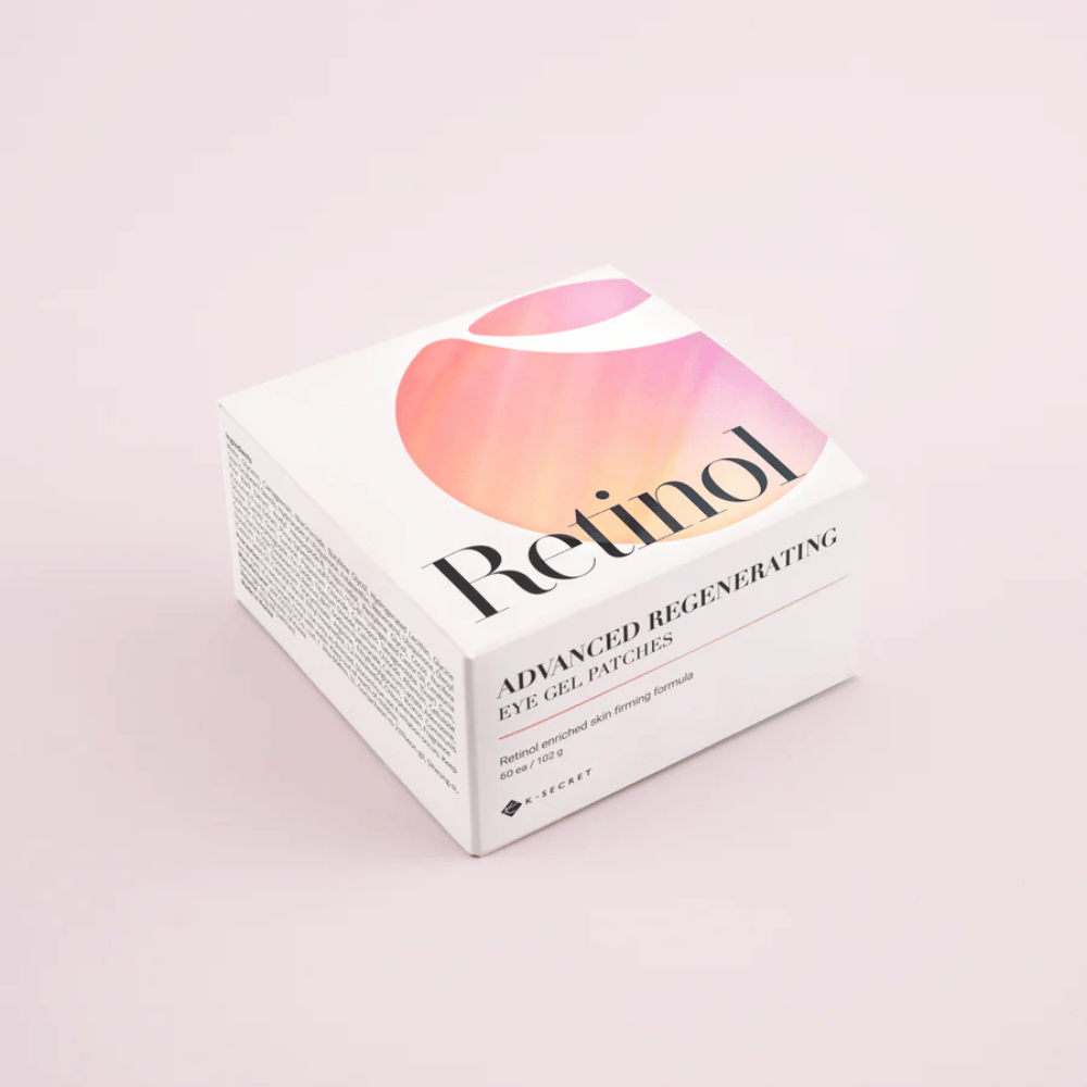 Empaque de K-Secret Advanced Regenerating Eye Gel Patches con retinol en diseño blanco y rosa.