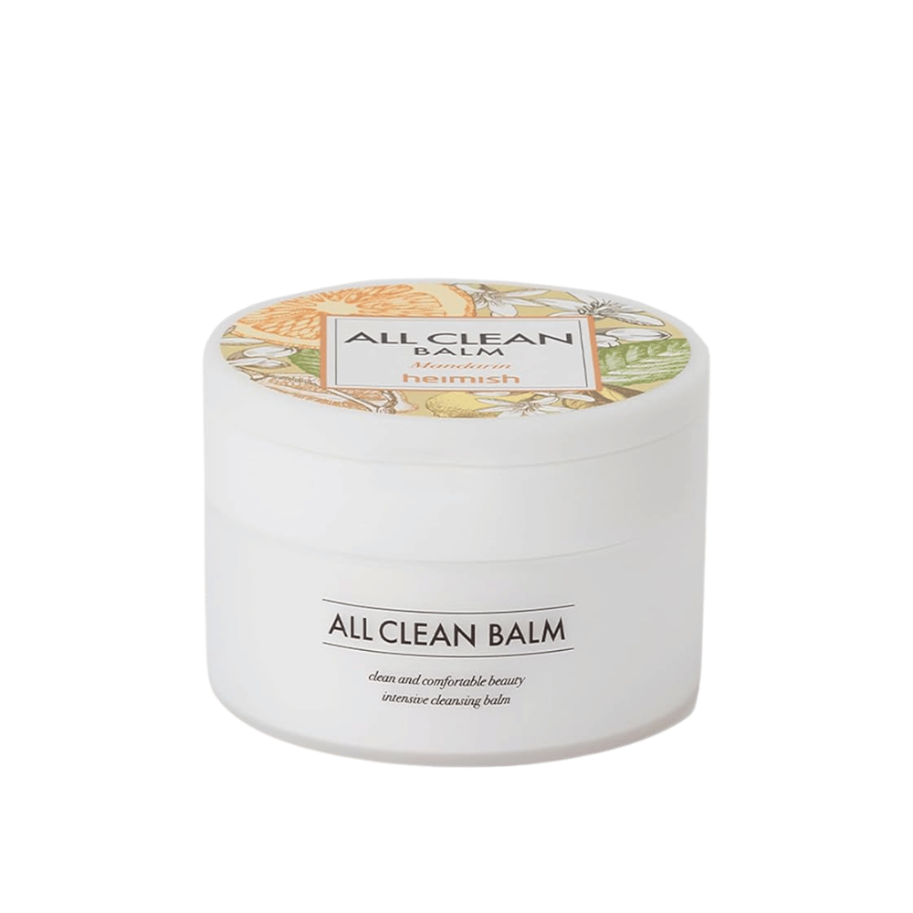 Un frasco de Heimish All Clean Balm con aroma a mandarina, un bálsamo de limpieza intensivo, con una etiqueta colorida y un empaque blanco.
