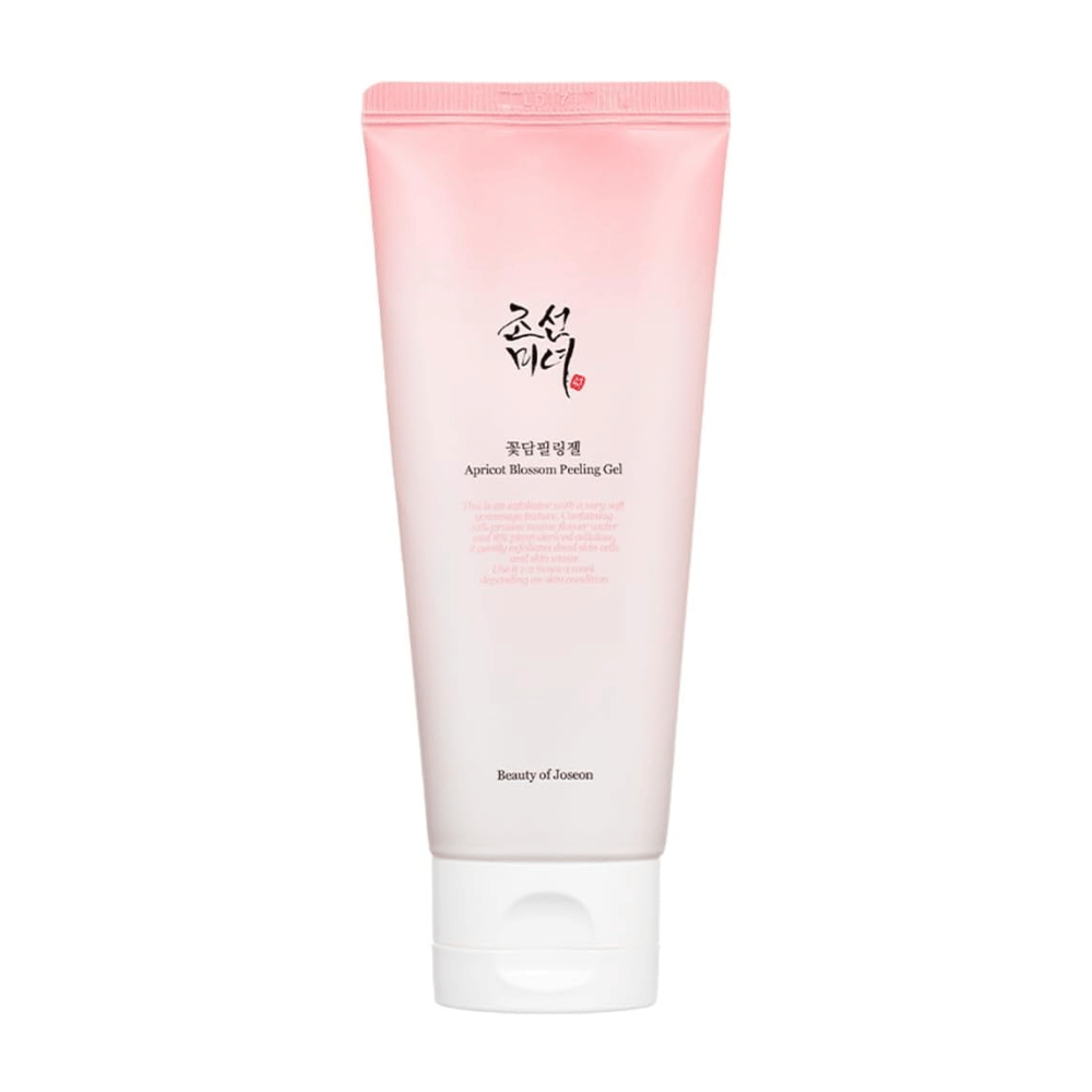 Un tubo rosa con Apricot Blossom Peeling Gel de Beauty of Joseon sobre un fondo blanco.