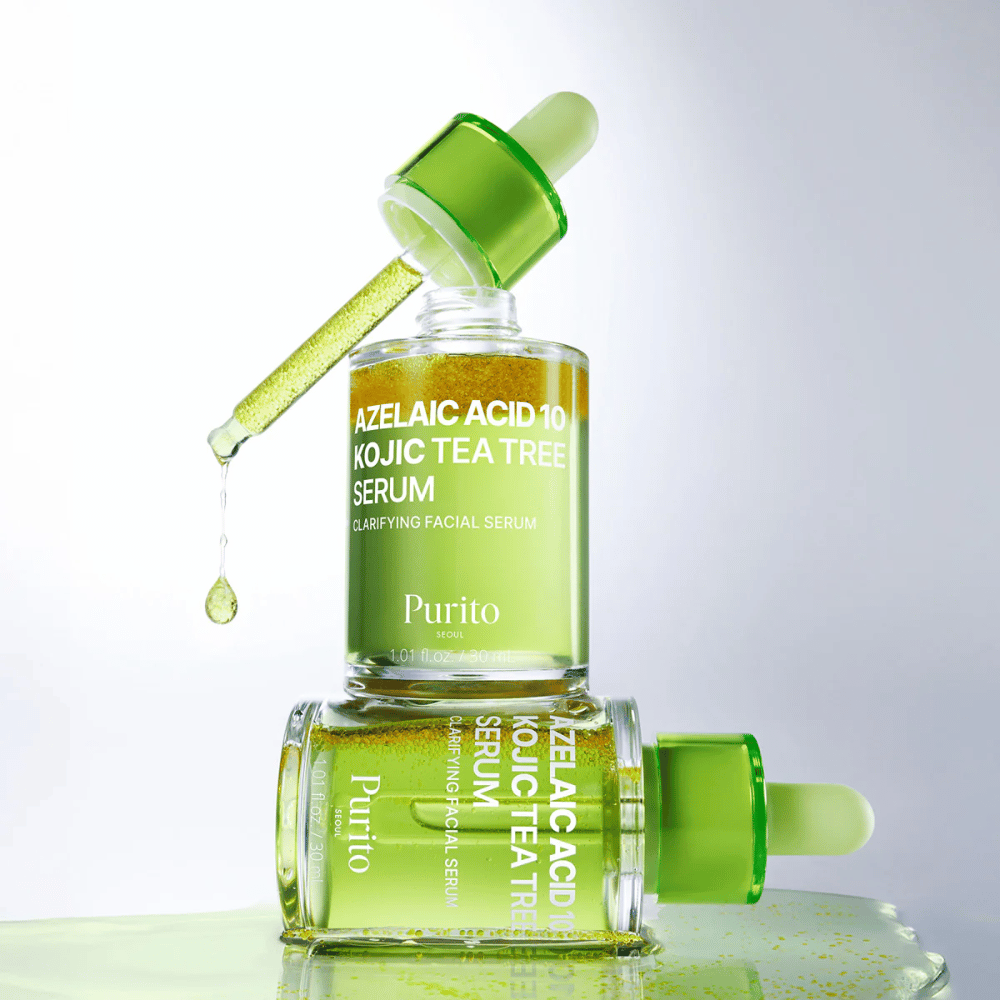 Purito Azelaic Acid 10 Kojic Tea Tree Serum – fórmula verde fresca con gota de pipeta que muestra la textura ligera del suero.