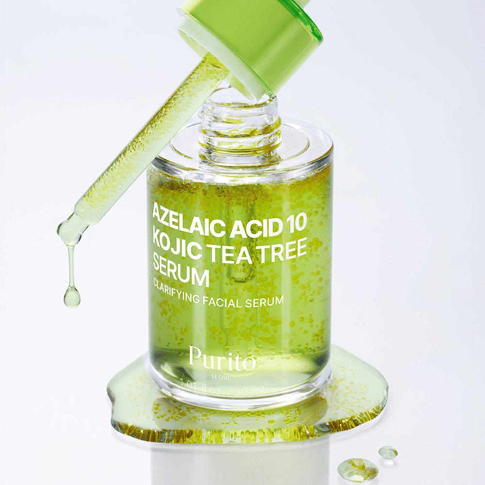 Primer plano de Purito Azelaic Acid 10 Kojic Tea Tree Serum con pipeta y gotas. Proporciona una piel más clara y reduce las impurezas.