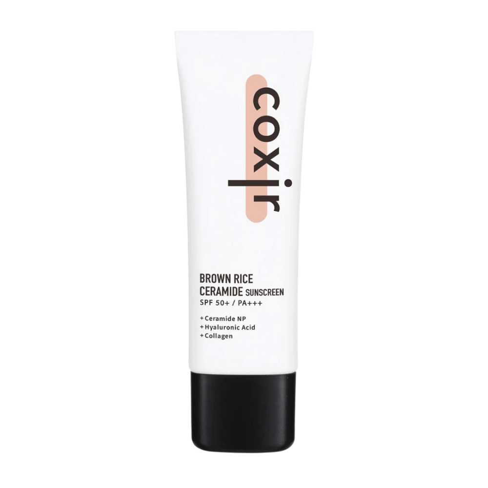Imagen del producto de Coxir Brown Rice Ceramide Sunscreen en tubo blanco con tapa negra, SPF 50+ PA+++, contiene ceramidas, ácido hialurónico y colágeno.