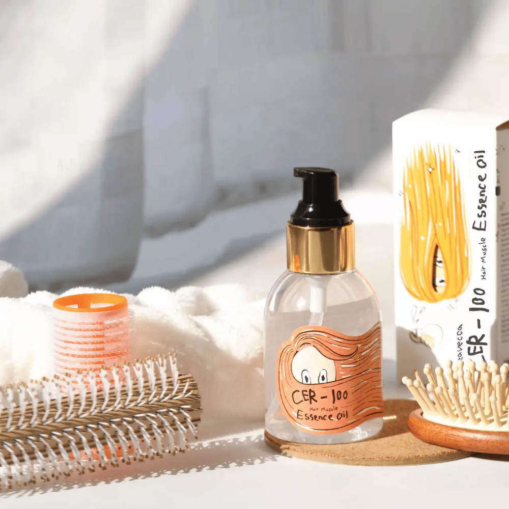 Elizavecca CER-100 Hair Muscle Essence Oil styling – aceite para el cabello hidratante que ayuda a reducir el frizz, dar brillo y proteger el cabello durante el peinado.