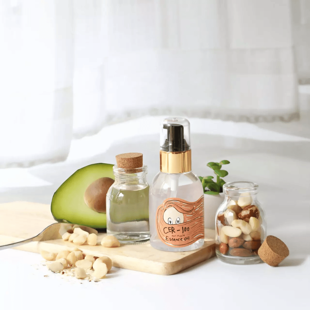 Elizavecca CER-100 Hair Muscle Essence Oil – aceite coreano para el cabello con aguacate y aceites naturales que ayuda a hidratar, fortalecer y dar brillo al cabello seco y dañado.