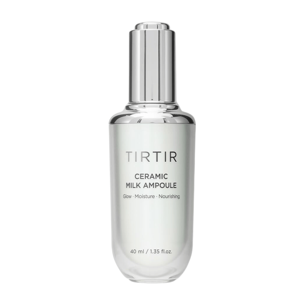  Una botella transparente TIRTIR Ceramic Milk Ampoule, etiquetada con "Glow - Moisture - Nourishing", sobre un fondo blanco.