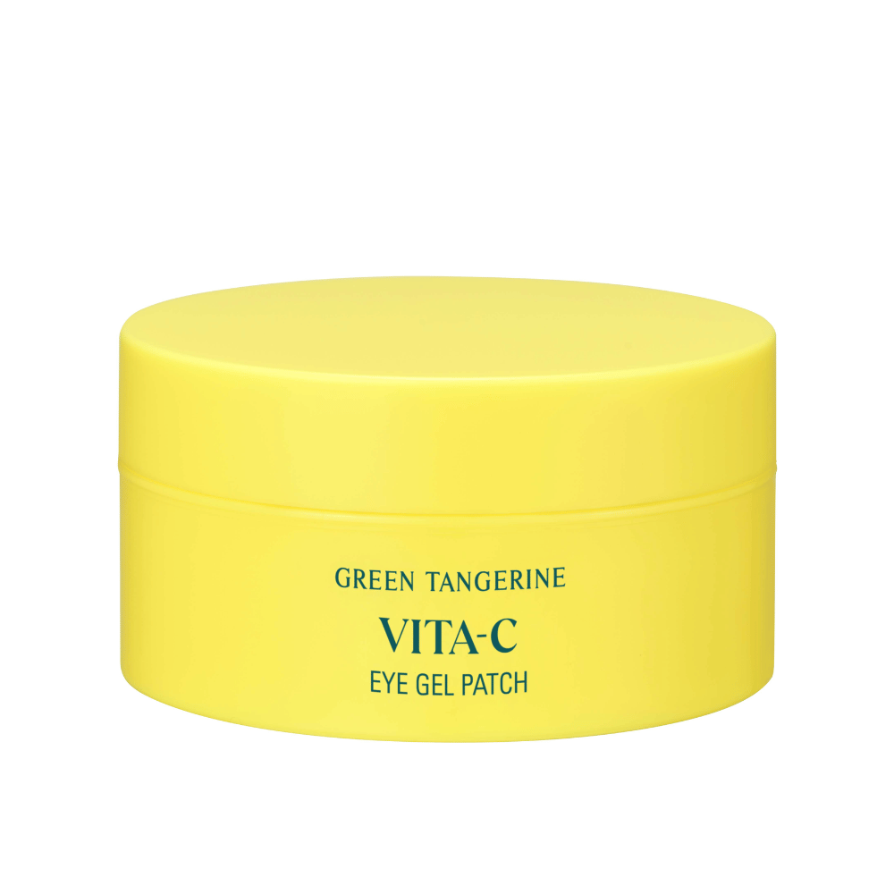 Un tarro amarillo etiquetado "GREEN TANGERINE VITA-C EYE GEL PATCH" probablemente máscaras para ojos que contienen vitamina C.