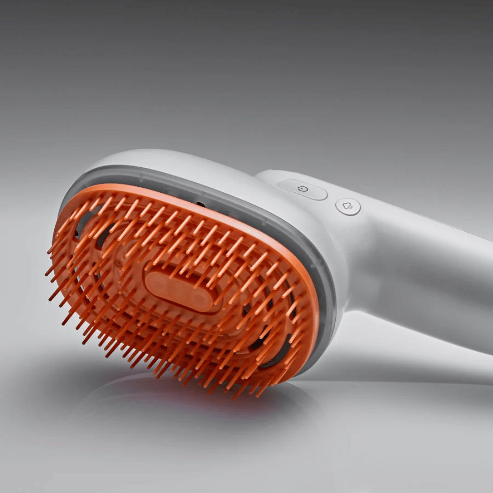 LILYEVE GrowTurn Brush Steam Booster – primer plano del cabezal del cepillo y los botones de control