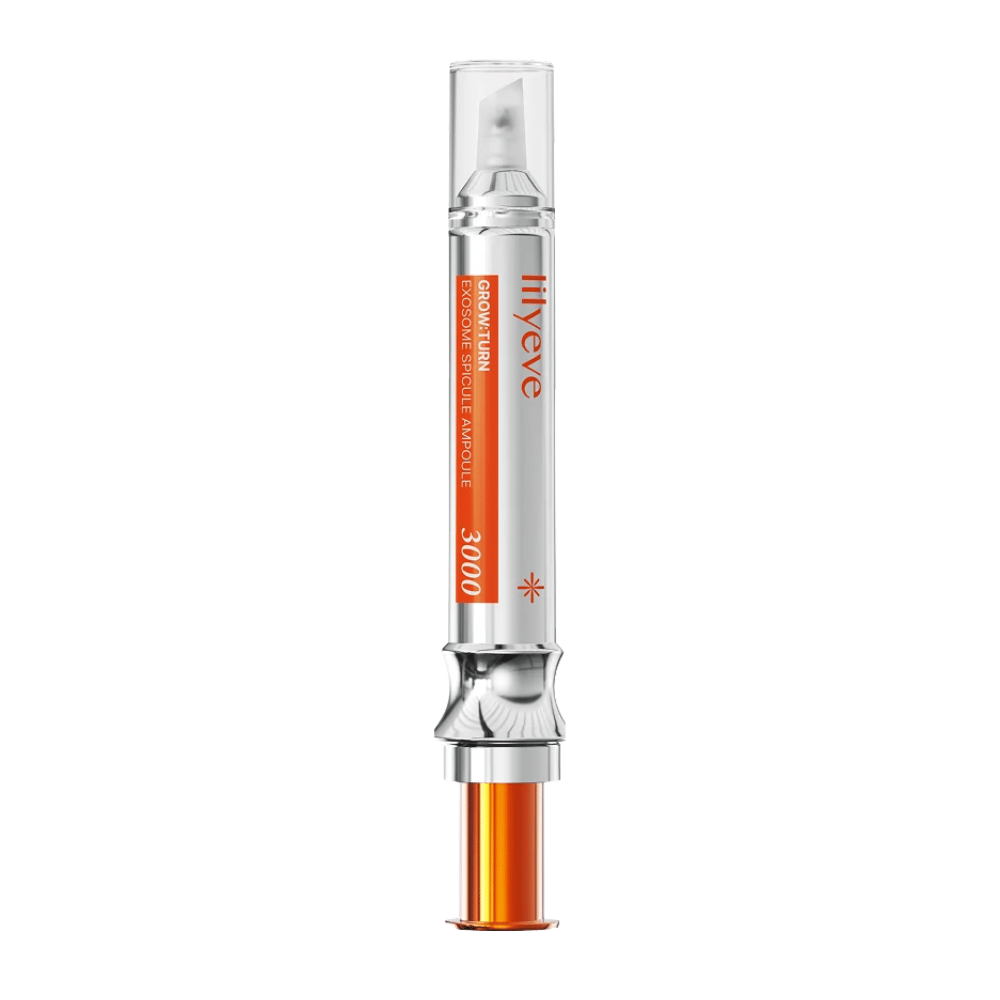 LILYEVE Grow Turn Exosome Spicule Ampoule 3000 – ampolla para el cuero cabelludo con aplicador de precisión en envase plateado y naranja.