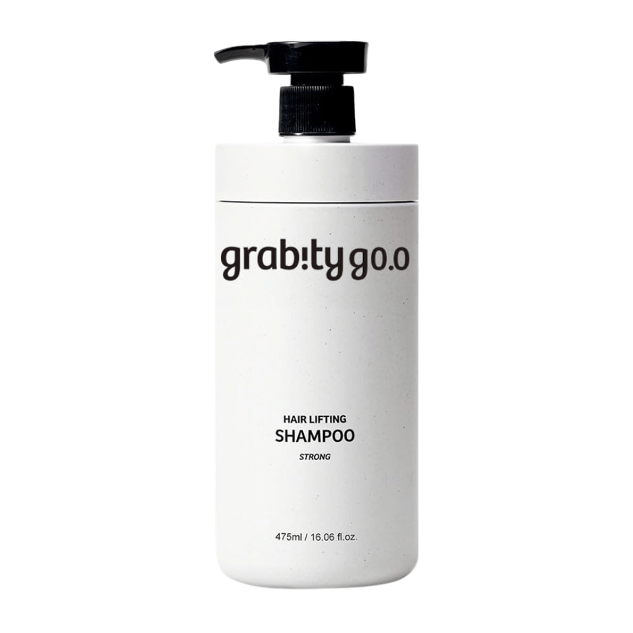 Grabity g0.0 Hair Lifting Shampoo Strong en un elegante frasco blanco con dispensador sobre fondo blanco, desarrollado para aportar volumen, fuerza y una apariencia de cabello más abundante.