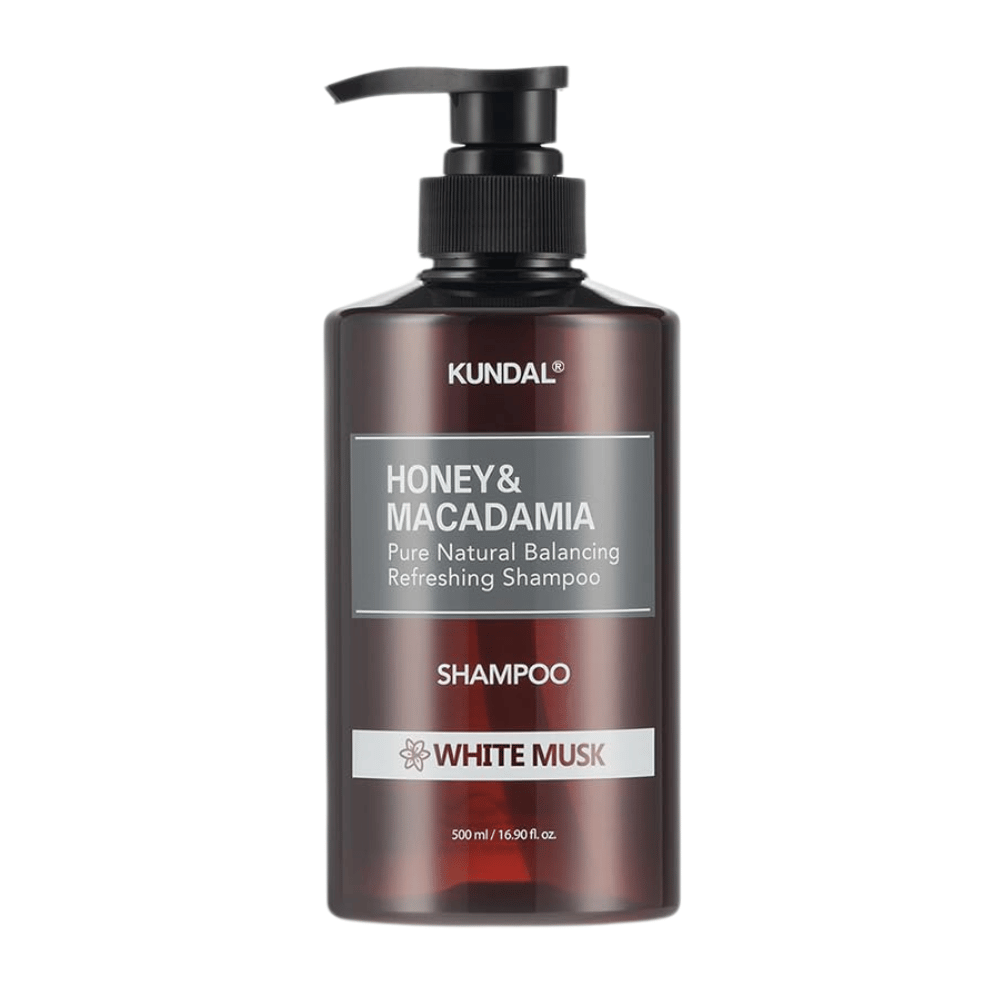 KUNDAL Honey & Macadamia Nature Shampoo White Musk en botella de plástico marrón con bomba, 500 ml.