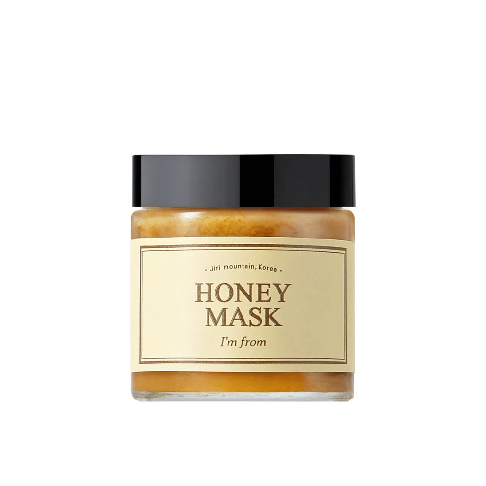  Un tarro "I'm from Honey Mask", con contenido natural de miel, sobre fondo blanco.