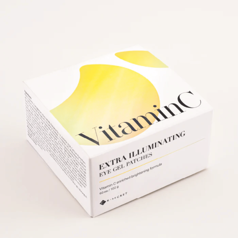 Empaque de K-Secret parches de gel para ojos extra iluminadores con vitamina C en diseño blanco y amarillo.