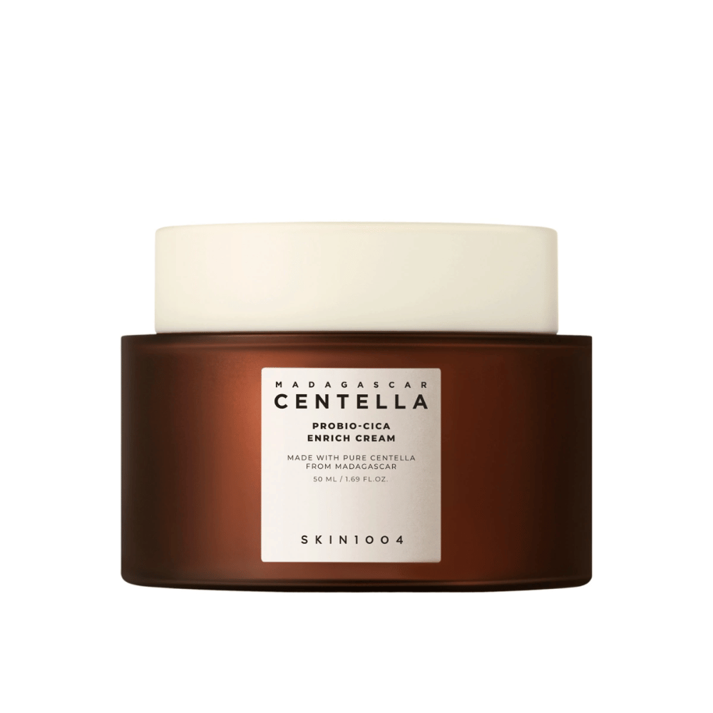 Un frasco marrón con Madagascar Centella Probio-Cica Enrich Cream contra un fondo neutral.