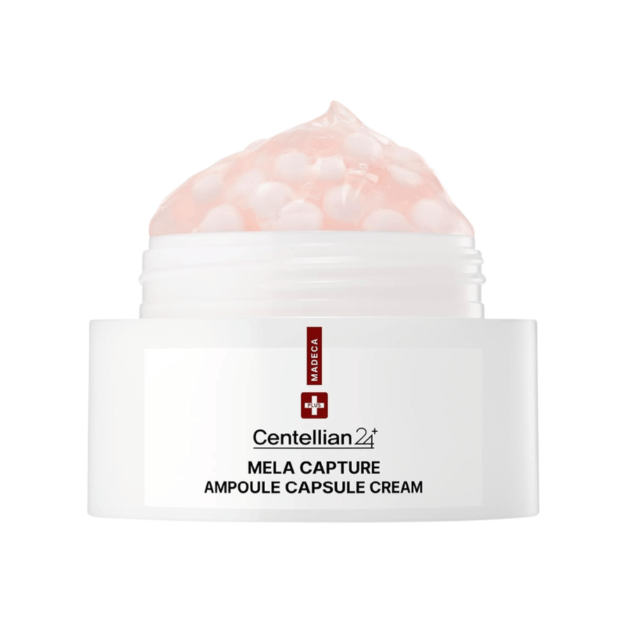 Primer plano de Centellian24 Madeca Mela Capture Ampoule Capsule Cream que muestra la crema en gel rosa con cápsulas de ampolla encapsuladas en el tarro.