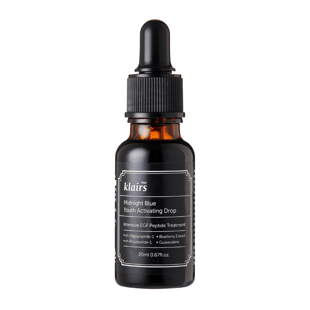 Klairs Midnight Blue Youth Activating Drop en una botella de vidrio oscuro con pipeta. El producto contiene péptidos EGF, extracto de arándano y guaiazuleno para promover la elasticidad de la piel y combatir los signos del envejecimiento.