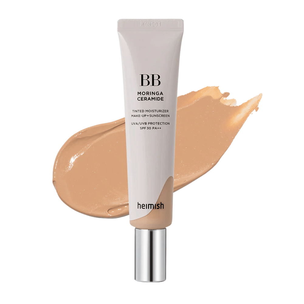 Imagen del producto de Heimish Moringa Ceramide BB Cream frente a una pincelada de crema BB beige. La imagen destaca un tono medio oscuro, así como las propiedades hidratantes y unificadoras del producto.