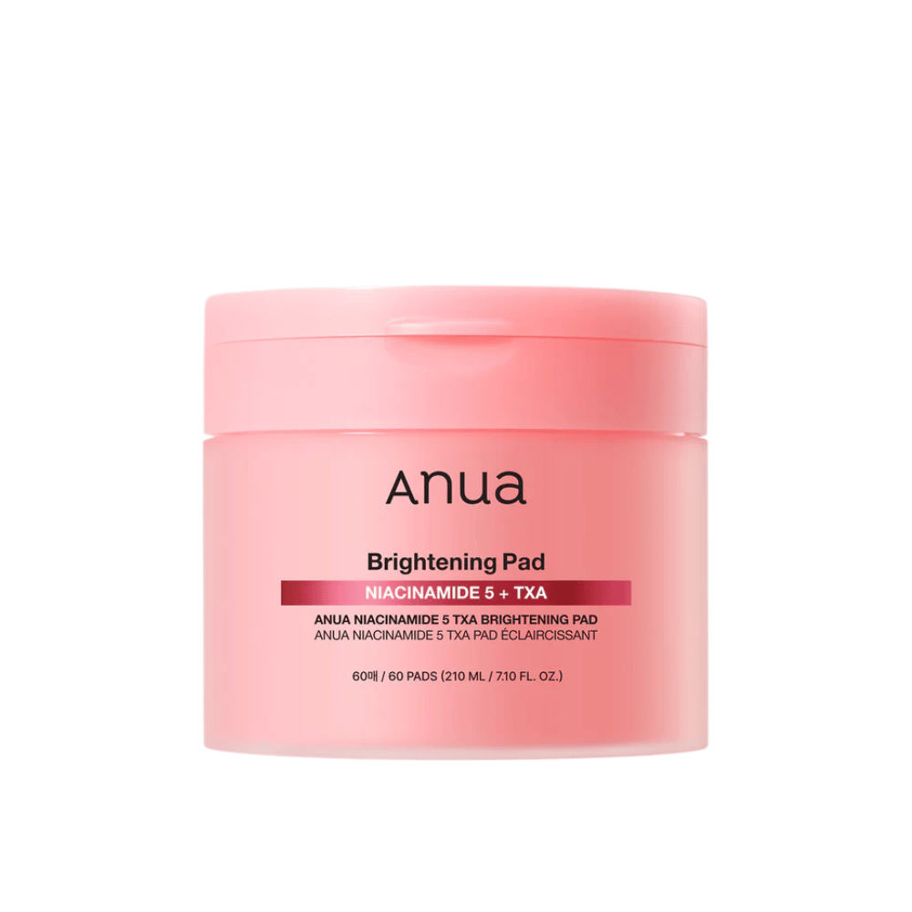 Paquete rosa de Anua Brightening Pad con el texto "Niacinamida 5 + TXA", contiene 60 almohadillas para el cuidado de la piel con enfoque en brillo y tono de piel más uniforme.