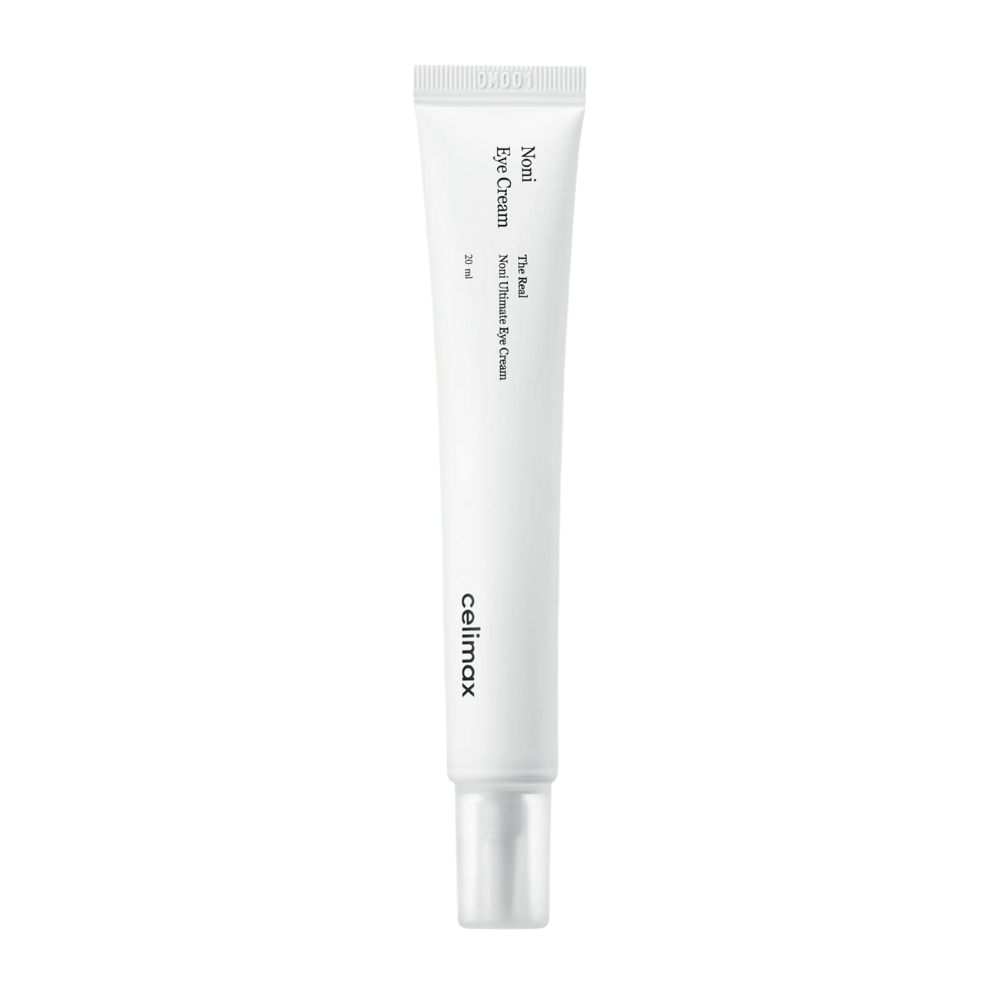 Noni Eye Cream en un tubo blanco con un tapón transparente. El producto es de la marca Celimax y contiene 20 ml. El texto en el tubo indica que es una crema para ojos nutritiva.