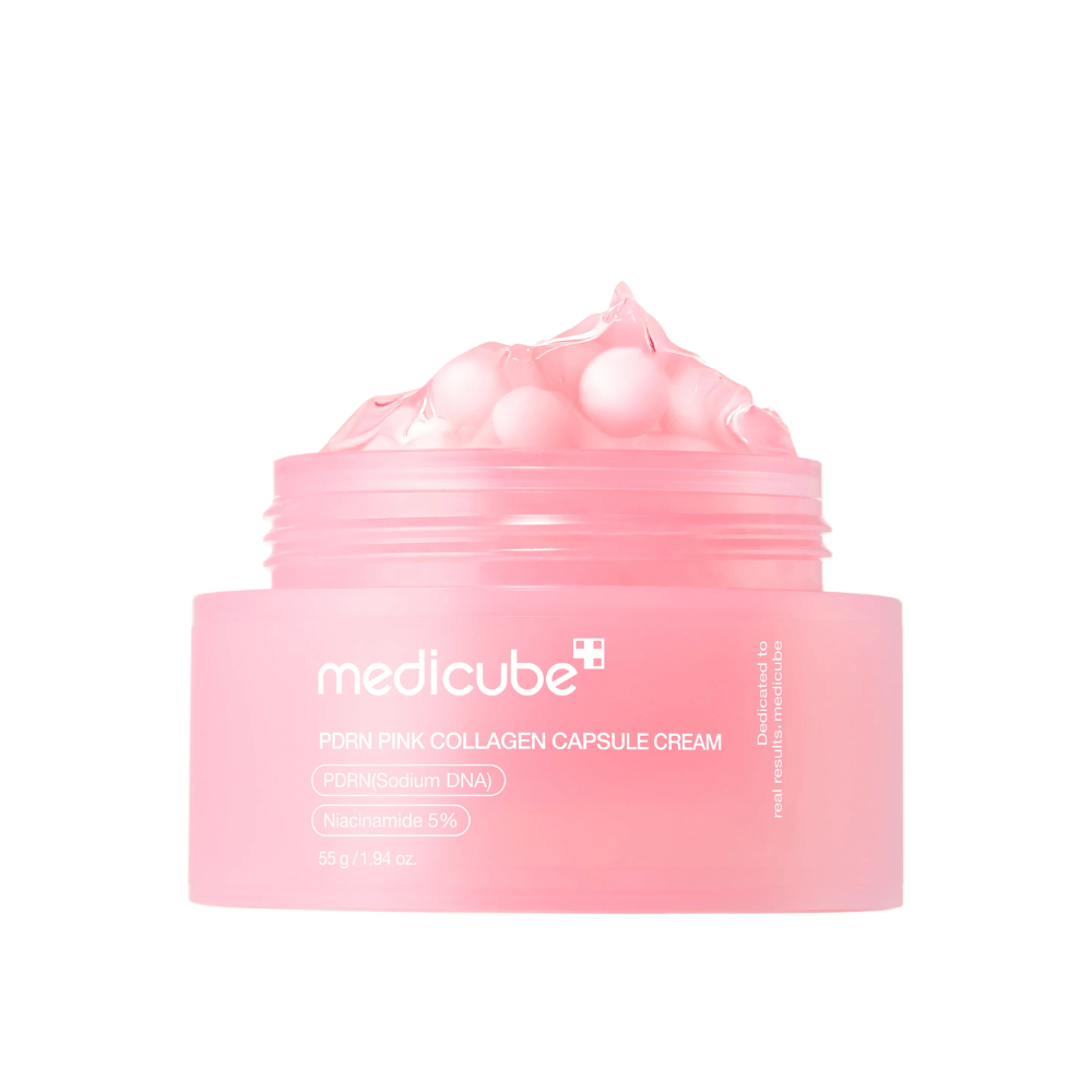 Imagen del producto de Medicube PDRN Pink Collagen Capsule Cream con cápsulas rosas visibles en un frasco rosa transparente, diseñado para hidratar y unificar el tono de la piel.
