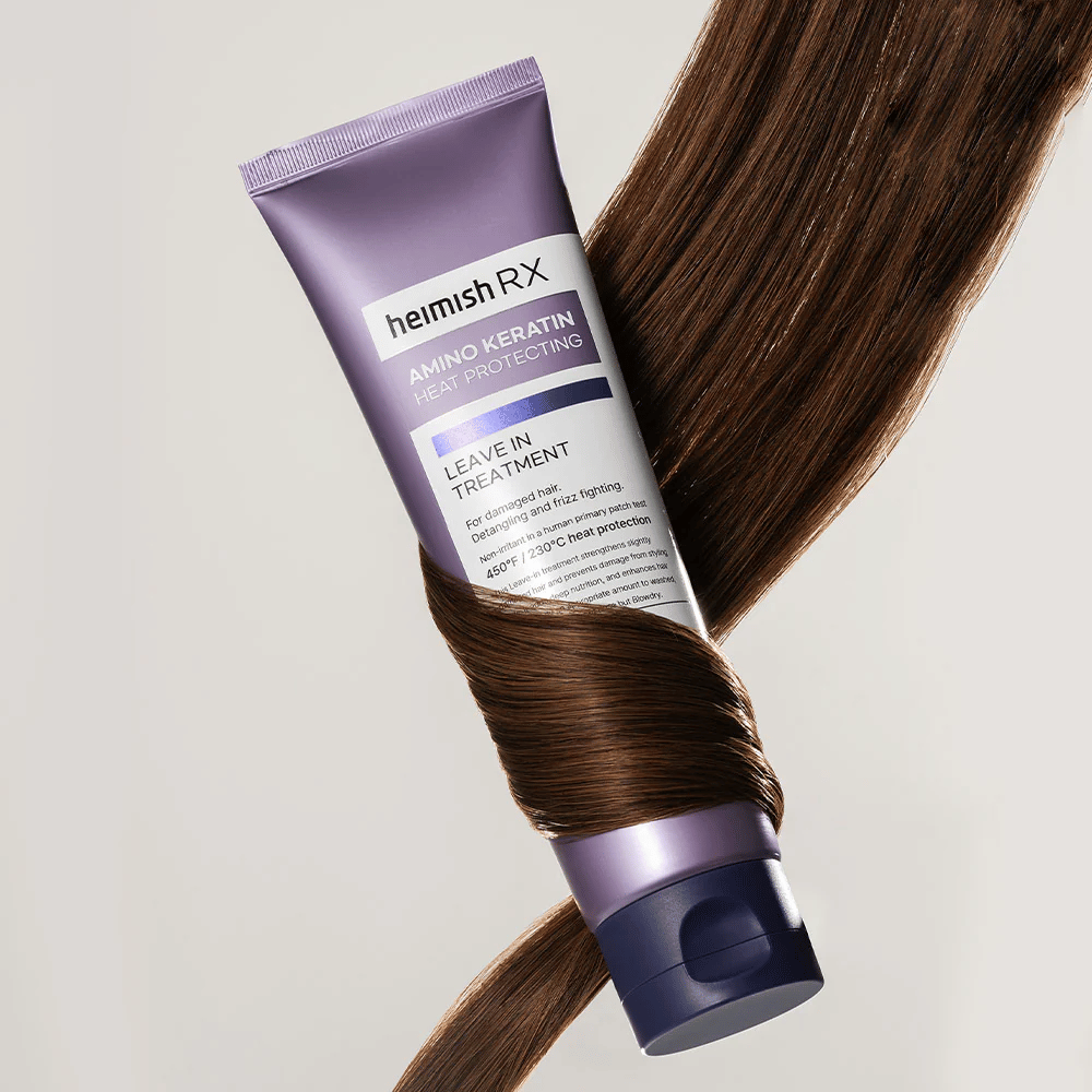 Heimish RX Amino Keratin Leave-In Treatment – tratamiento capilar nutritivo y protector térmico rodeado de cabello brillante, simboliza el efecto fortalecedor e hidratante para el cabello dañado.