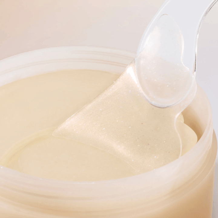 Espátula levantando Beauty of Joseon parche para ojos del tarro, parches de hidrogel con ginseng y retinal para anti-edad y cuidado de ojos.