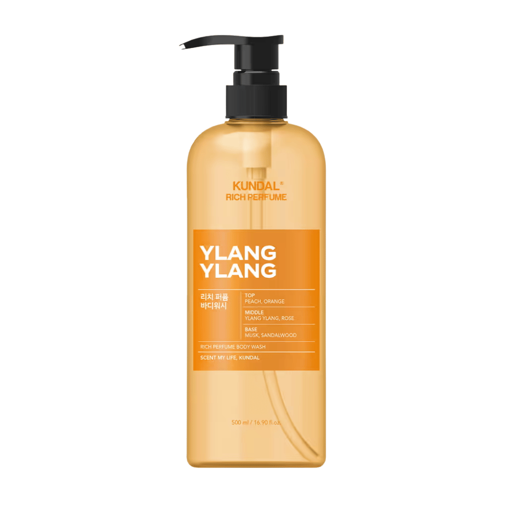 6. KUNDAL Rich Perfume Body Wash Ylang Ylang 500 ml – jabón de ducha naranja con botella con dosificador