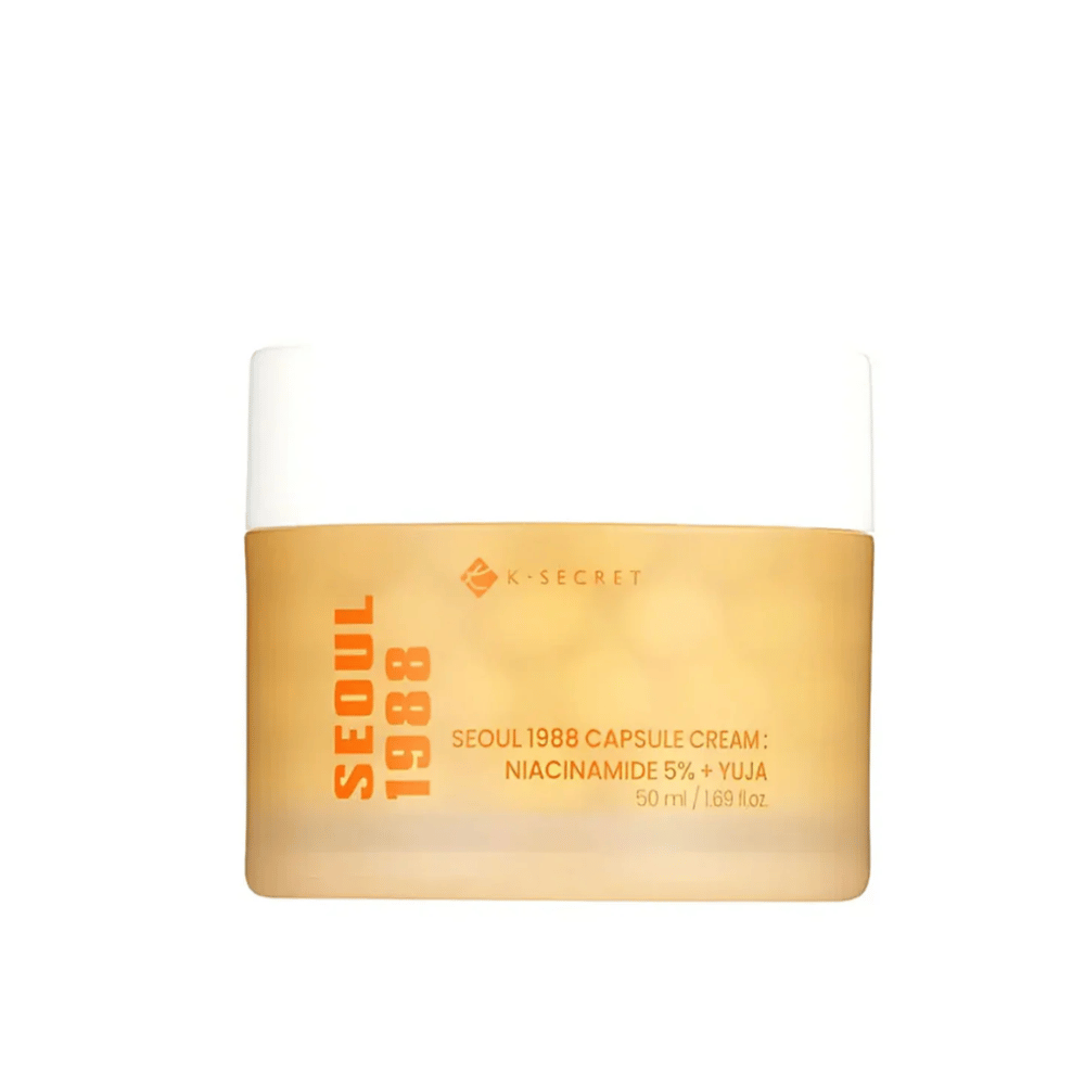 Bote con K-Secret Seoul 1988 Capsule Cream Niacinamida 5% + Yuja, 50 ml, en envase diseñado dorado.
