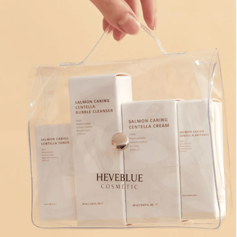 Heveblue Salmon Caring Centella Special Travel Kit neceser – completo set de cuidado de la piel coreano con tóner, limpiador, crema y ampolla en un neceser transparente.