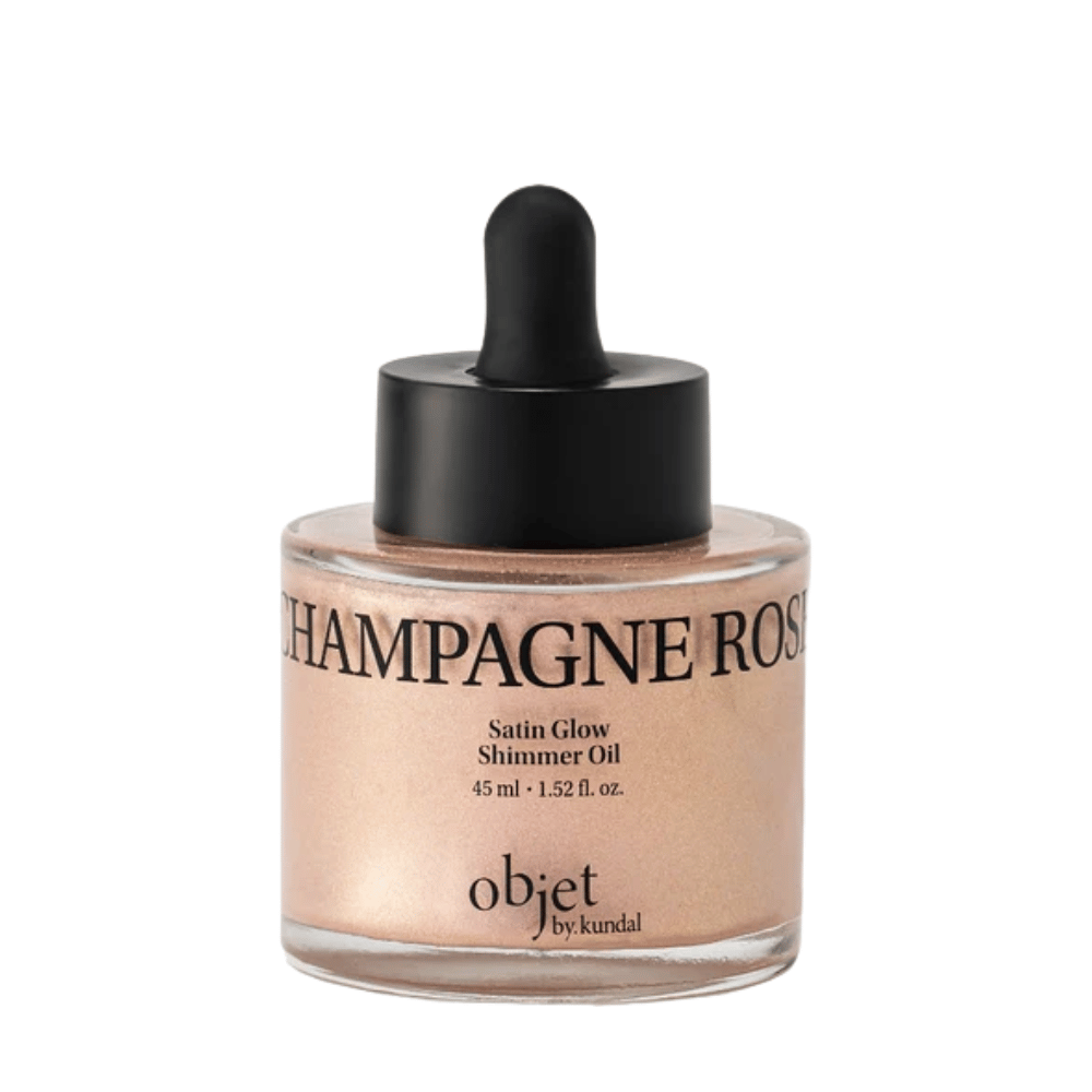 Objet by KUNDAL Satin Glow Shimmer Oil Champagne Rose 45 ml – aceite corporal iluminador con un delicado acabado brillante en oro rosado.