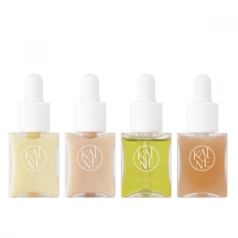 Cuatro frascos de suero coloridos de KAINÉ Serum Discovery Kit con tapa de pipeta, diseñados para satisfacer diferentes necesidades de la piel en un empaque minimalista y elegante.