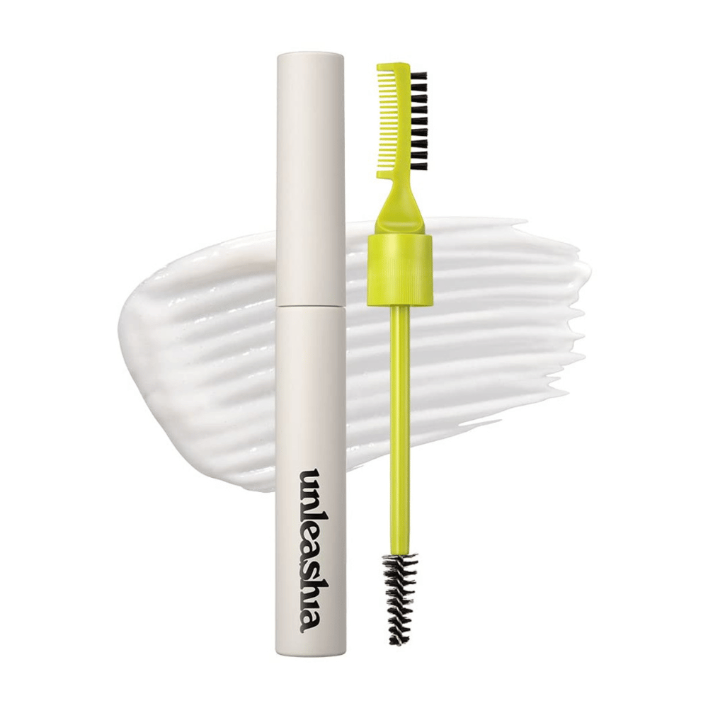 Pomada para cejas "unleashia" con aplicador, peine verde y cepillo negro sobre un fondo blanco ondulado.