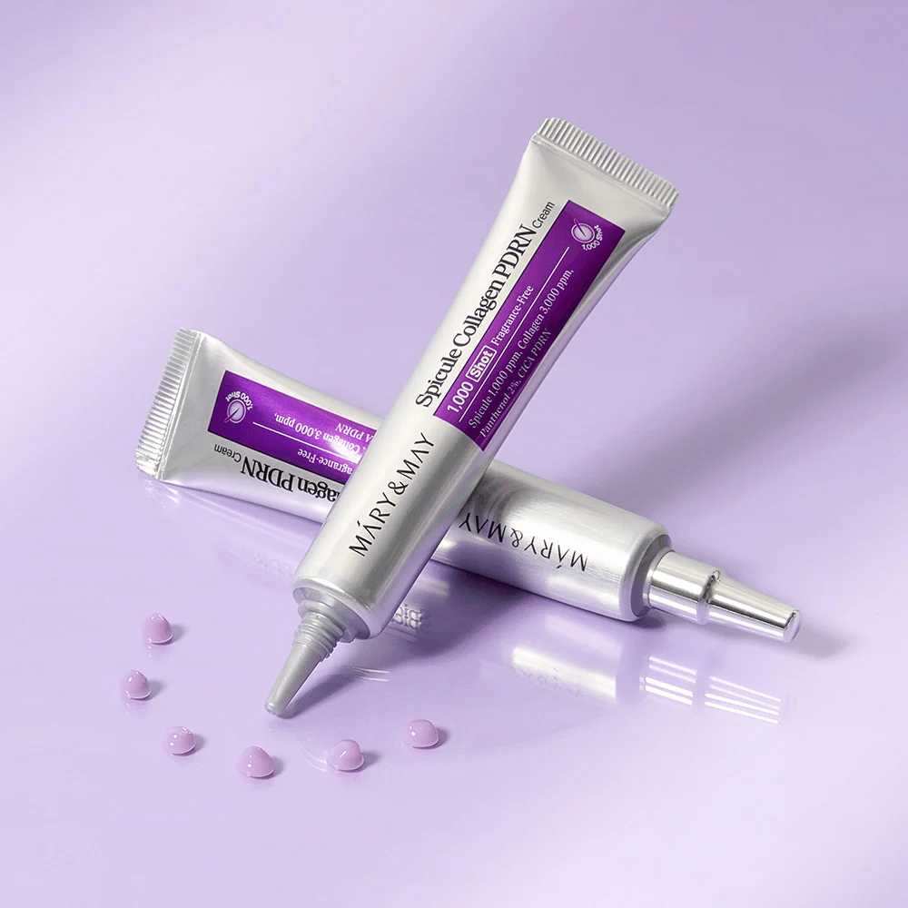 Mary & May Spicule Collagen PDRN Cream en varios tubos sobre fondo lila, crema facial intensamente regeneradora con tecnología de espículas y colágeno.