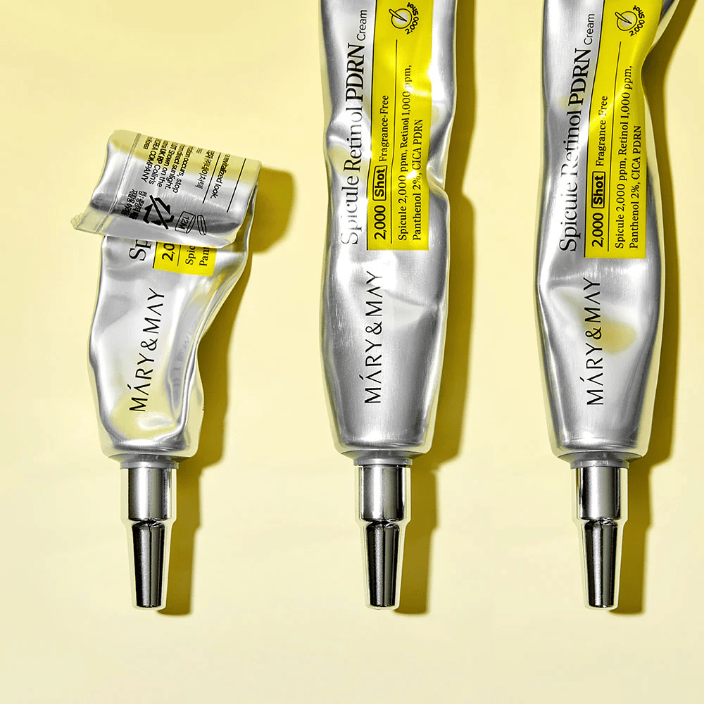 MARY & MAY Spicule Retinol PDRN Cream con aplicación visible en tubo, muestra la consistencia de la crema y el aplicador dirigido para una aplicación precisa en la piel.