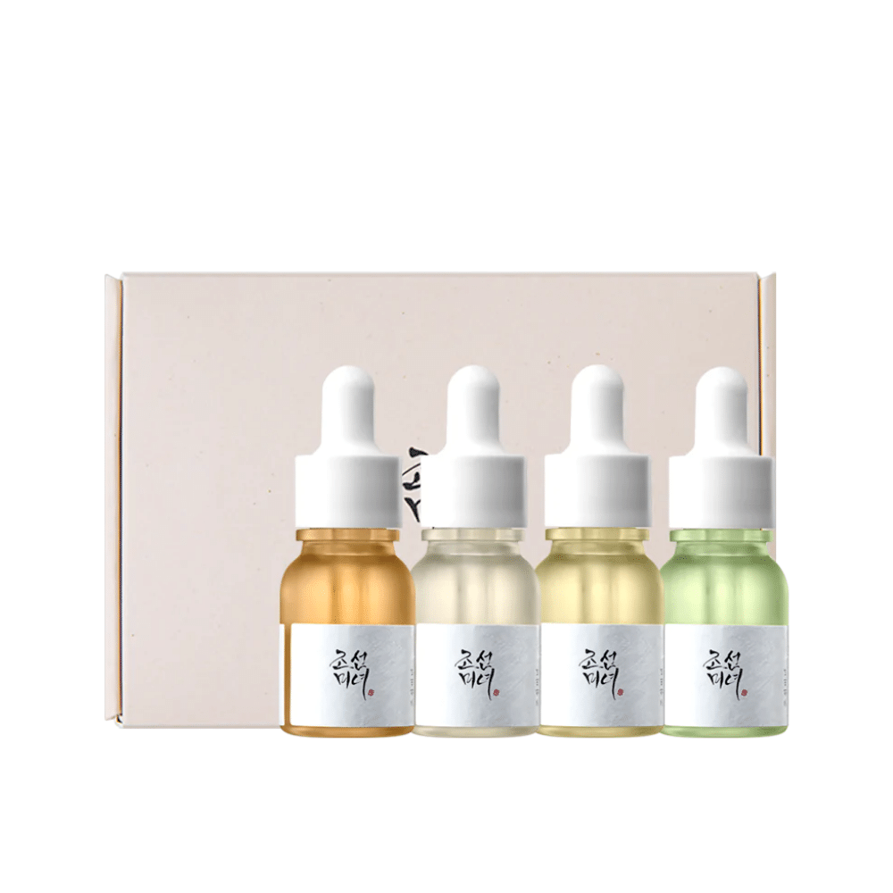 Una caja con tres botellas Hanbang Serum Discovery Kit 4 uds de Beauty of Joseon, cada una de las cuales promueve un brillo juvenil y reduce las arrugas.